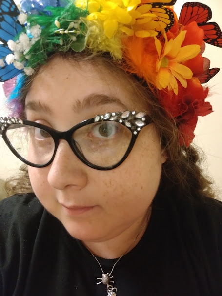 Spring 2022: Myself modeling the finished product. The headpiece fits snugly onto my head and does not wobble around and all of the adornments have been securely applied. Original design by me