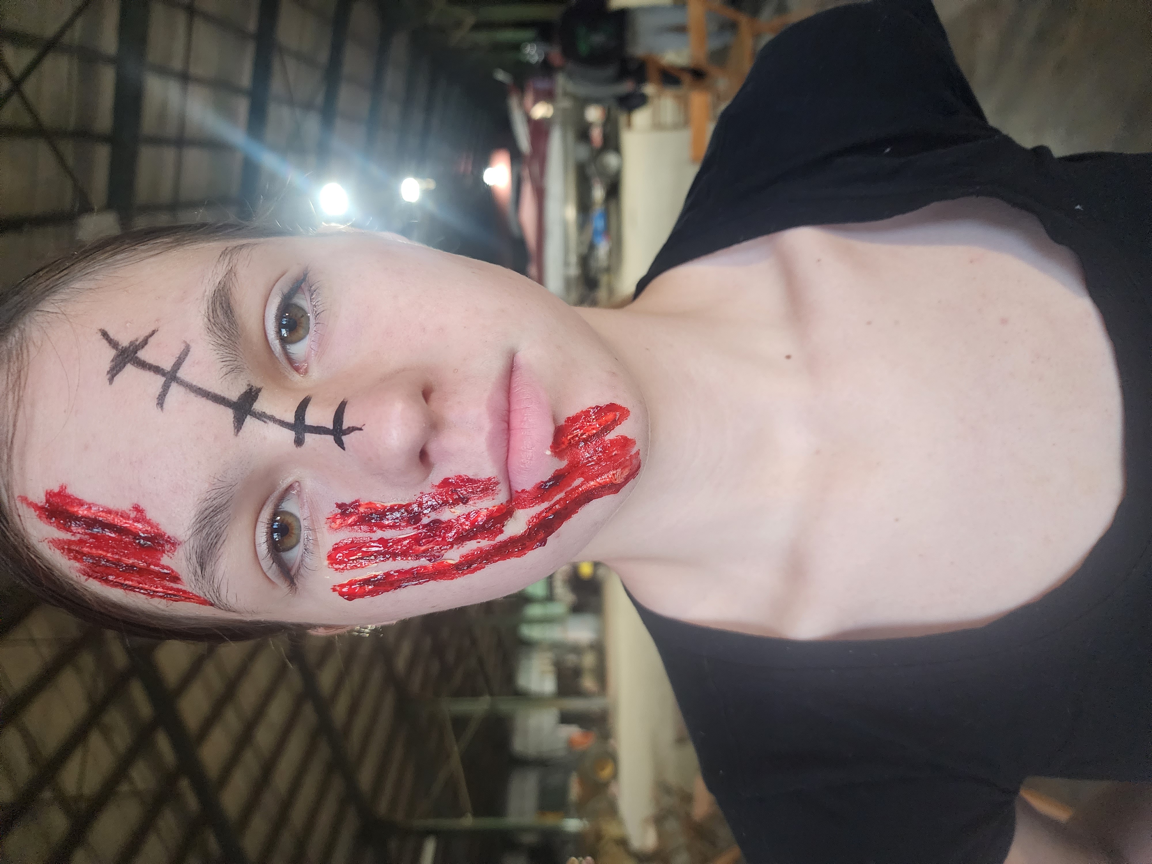 Large claw marks on face done with liquid latex and thick blood, shading done with bruise wheel; client insisted on having a stitched scar added despite my insistence it didn&rsquo;t fit the vibe